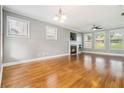 Bright living room featuring a fireplace, hardwood floors, and large windows at 1777 Meadow Sw Ln, Atlanta, GA 30315