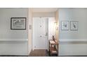 Inviting hallway with unit number 427 and elegant decor, leading to the main entrance at 1800 Clairmont Lk # 427, Decatur, GA 30033