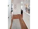 Long hallway with hard wood floors, with multiple rooms visible, and white paint at 1800 Clairmont Lk # 427, Decatur, GA 30033