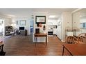 Open-concept living space with hard wood floors connecting the living, dining, and kitchen areas at 1800 Clairmont Lk # 427, Decatur, GA 30033