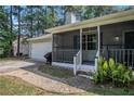 Close up view of the front porch and exterior showing a gas grill and painted siding at 2780 Highpoint Rd, Snellville, GA 30078