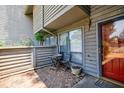 Cozy outdoor patio with brick flooring and small table with chairs at 1002 Creatwood Se Cir, Smyrna, GA 30080