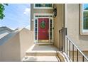 Welcoming red front door with glass panes and a seasonal wreath at 2556 Oakwood Se Trce, Smyrna, GA 30080