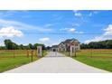 Long driveway leading to an upscale home with a gated entrance at 3284 Hall Rd, Dacula, GA 30019