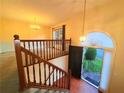 Welcoming foyer featuring hardwood floors, staircase, and arched transom window at 1047 Martin Heights Dr, Lawrenceville, GA 30044