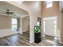 Spacious living room with hardwood floors, neutral paint, and lots of natural light at 348 Weatherstone Place Pl, Woodstock, GA 30188