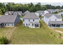 Aerial view of backyard featuring covered patio and view of the surrounding neighborhood at 2260 Cedar Place Ct, Snellville, GA 30078