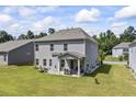 Spacious backyard featuring a covered patio and plenty of green space for outdoor activities at 2260 Cedar Place Ct, Snellville, GA 30078