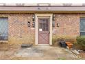 Exterior entrance with a brick facade, traditional door, and unit numbers at 3187 Abbeywood Dr, Decatur, GA 30034