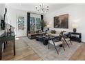 Bright living room featuring a large window, stylish furniture, and hardwood floors at 1392 Cozy Cir # 349, Atlanta, GA 30315