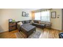 Comfortable living room featuring a gray sectional sofa, patterned rug, and natural light at 2232 Dunseath Ave # 407, Atlanta, GA 30318