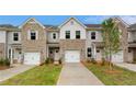 Inviting townhome exteriors showcase brick facades, single-car garages, and well-maintained landscaping at 349 Navigator Ln, Mcdonough, GA 30253