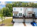 Two-story townhome featuring a drive-under garage and private balcony at 1150 Buice Lake Pkwy, Acworth, GA 30102