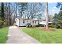 Quaint one-story home with a neatly landscaped yard and a welcoming driveway at 1084 Fairburn Nw Rd, Atlanta, GA 30331