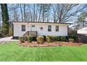 Charming single-story home with a landscaped front yard, complemented by a quaint entrance and fresh exterior at 1084 Fairburn Nw Rd, Atlanta, GA 30331