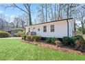 A bright one-story home features a well-maintained lawn and established landscaping at 1084 Fairburn Nw Rd, Atlanta, GA 30331