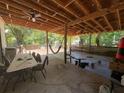 Expansive covered back deck with ceiling fans, ample seating, and plenty of room for entertaining at 1771 Kristi Dr, Lawrenceville, GA 30043