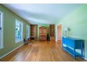 Bright and airy living room featuring hardwood floors, large windows, and custom built-ins at 1831 Galilee Ct, Tucker, GA 30084