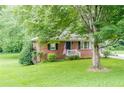 Quaint brick home with lovely front yard and mature trees offering plenty of shade at 2194 Freydale Se Rd, Marietta, GA 30067