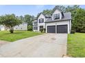 Charming two-story home with a well-maintained lawn and a two-car attached garage at 1069 Alford Rd, Lithonia, GA 30058