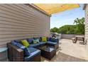 Comfortable rooftop deck features a large sectional, grill, and shade, perfect for outdoor relaxation at 1265 Wright Se Ln, Atlanta, GA 30316