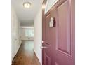 View from front door showing hardwood floors that flow into the living space with window views at 1834 Buckeye Sw St, Atlanta, GA 30310