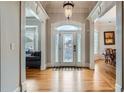 Elegant foyer with hardwood floors, a decorative front door, and open views of the living spaces at 1025 Ector Nw Dr, Kennesaw, GA 30152