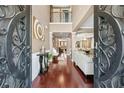 Grand foyer showcasing hardwood floors, an open floor plan, and elegant details throughout, offering a luxurious welcome at 1146 Simonton Peak Way, Lawrenceville, GA 30045