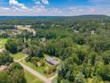 A serene single-story home nestled in lush woods offering both privacy and beautiful scenery at 1725 Mountainside Dr, Cumming, GA 30040