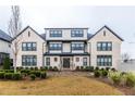 Charming two-story home features a brick facade, manicured landscaping, symmetrical windows, and inviting entrance at 3933 Danube Ln # 224, Atlanta, GA 30339