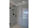Walk-in shower featuring gray tiling, and modern fixtures at 1919 Deco Dr, Kennesaw, GA 30144