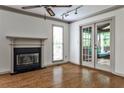 Inviting living room boasts a fireplace, and glass doors opening to an outdoor porch at 105 Bruton St, Decatur, GA 30030