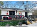 Spacious backyard deck features lounge seating, an outdoor heater and room for entertaining at 3236 Jonesboro Rd, Atlanta, GA 30354