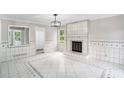 Spacious living room with tiled floor, a fireplace, and abundant natural light at 3333 Devaughn Ne Dr, Marietta, GA 30066