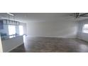 Open concept living room featuring neutral walls and modern wood-look flooring at 3484 Enterkin Ln, Atlanta, GA 30349