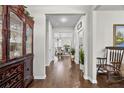 Welcoming foyer featuring hardwood floors, neutral paint, and an open view to the dining area at 450 Noblewood Dr, Mcdonough, GA 30252