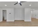 Living room boasting freshly painted white walls, hardwood floors, and modern ceiling fan at 2358 Tilson Rd, Decatur, GA 30032