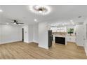 Open floor plan with bright living room flowing into a modern kitchen with an island at 2358 Tilson Rd, Decatur, GA 30032