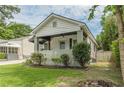 Cozy home with manicured lawn, quaint front porch, and charming curb appeal at 523 North Ave, Atlanta, GA 30354