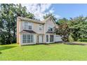 Charming home with a neatly kept front lawn and a convenient two car garage at 3604 Cameron Hills Pl, Ellenwood, GA 30294