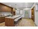 Modern kitchen featuring sleek cabinets, a large island with seating, and stainless steel appliances at 531 Atlanta Se Ave, Atlanta, GA 30315