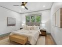 Serene main bedroom with a large window, neutral color palette, and hardwood floors at 531 Atlanta Se Ave, Atlanta, GA 30315