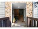 Entrance featuring stone walls, wooden stairs and neutral paint at 1102 Madison Se Ln # 1102, Smyrna, GA 30080