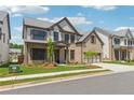 Charming two-story brick home with an attached garage, showcasing curb appeal and landscaping at 5340 Candun Cir, Sugar Hill, GA 30518