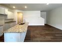 Modern kitchen featuring stainless steel appliances and granite countertops at 1909 Victoria Way # 116, Conyers, GA 30013
