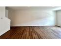 Spacious living room with hardwood floors and neutral paint at 1909 Victoria Way # 116, Conyers, GA 30013