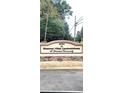 Shannon Villas Condominiums signage located at 4701, surrounded by beautiful plants and a stone base at 4701 Flat Shoals Rd # 25F, Union City, GA 30291
