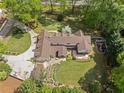 Aerial view of a large, well-maintained property with lush greenery and a sprawling home with a rear deck at 299 Saint Marys Nw Ln, Marietta, GA 30064