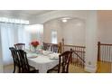 Beautiful dining room with hardwood floors and decorative crystal chandelier at 10785 Arlington Pt, Alpharetta, GA 30022