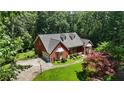 Gorgeous brick home with mature trees and a spacious front yard at 1950 Lower Burris Rd, Canton, GA 30114